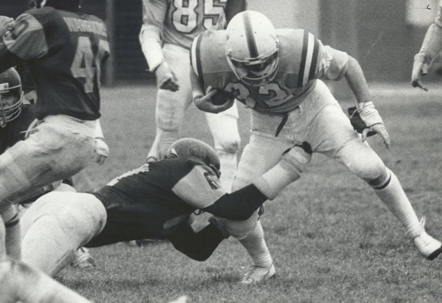 John Silverthorne #32 breaks a tackle, 1979-80.